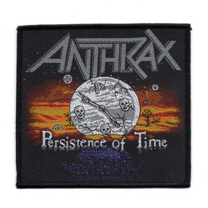 May include: Black and white woven patch with the band name Anthrax in white lettering and the words "Persistence of Time" in white lettering. The patch features a clock face with a broken hand and skulls.