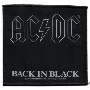 May include: Black and white embroidered patch with the text "AC/DC Back in Black" and the copyright information "©2001 LEIDSEPLEIN PRESSE BV U.L.T. ANTHILL".