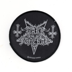 May include: Black and white embroidered patch featuring a pentagram, two inverted crosses, and the text "DARK FUNERAL" in a gothic font. The patch has a black background and is surrounded by a white border. The text "©2016 DARK FUNERAL" is printed in white at the bottom of the patch.
