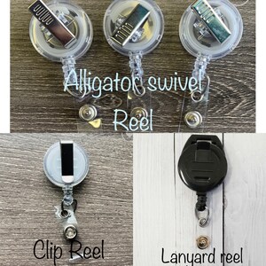 May include: Clear plastic badge reels with silver alligator clips, a clip reel, and a lanyard reel. The text "Alligator swivel Reel" and "Clip Reel" are visible. The lanyard reel is black.