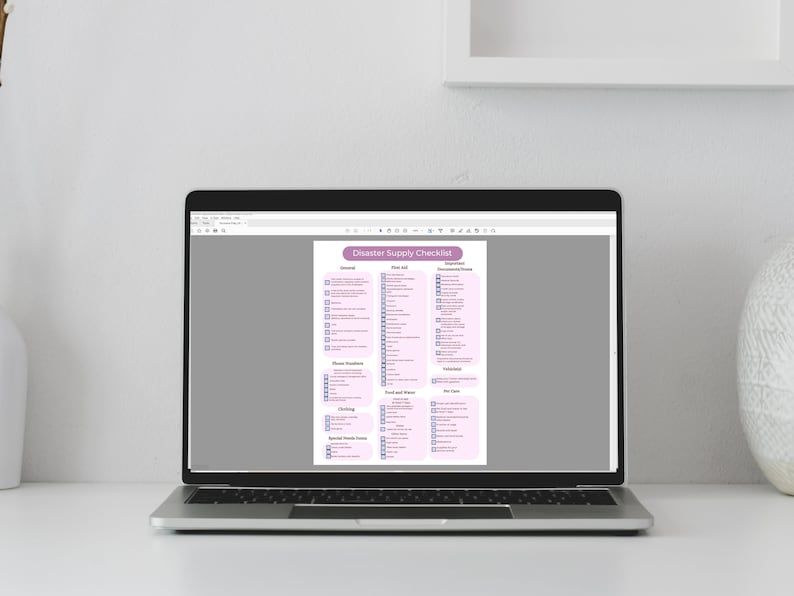 May include: A laptop computer displaying a checklist titled "Disaster Supply Checklist". The checklist is divided into categories such as "General", "First Aid", "Emergency Documents", "Water", "Food and Water", "Clothing", "Special Needs Items", and "Other Items".