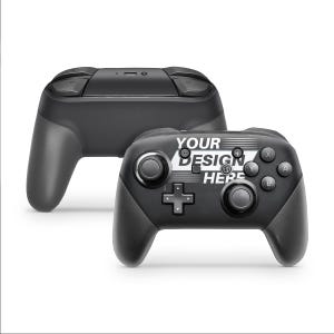 May include: Two black Nintendo Switch controllers. The controller on the left is a standard controller. The controller on the right has a white design that says "YOUR DESIGN HERE".