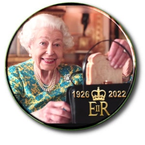 May include: A circular image showing a smiling woman in a floral top and pearls, holding a black handbag. The bag displays "1926 2022" and a crown, and contains a sandwich. The image has a green border.