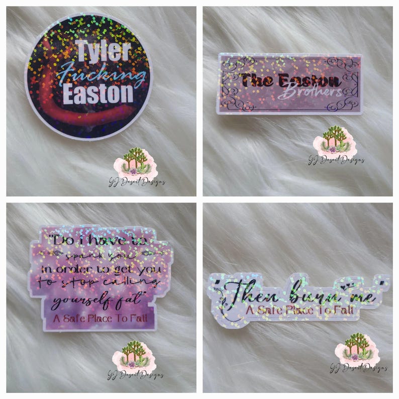 May include: Four holographic stickers with text. One sticker reads "Tyler Fucking Easton" in blue and white on a dark background. Another says "The Easton Brothers" in purple. The other two stickers have quotes from "A Safe Place To Fall".