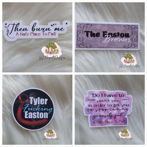 May include: A collection of four stickers with various text designs. One sticker reads "Then burn me, A Safe Place To Fall." Another says "The Easton Brothers." A third sticker says "Tyler Fucking Easton." The last sticker says "Do I have to spank you..."