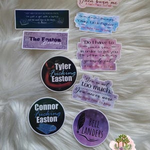 May include: A collection of stickers with quotes and text. The stickers feature phrases like "Then burn me" and "I'm just a girl with a laptop." Some stickers have character names like "Tyler Fucking Easton" and "Connor Fucking Easton."