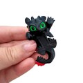 Adorable Black Dragon Figurine: Versatile Decor for Phone, Laptop, Bookshelf, or Photo Frame product logo