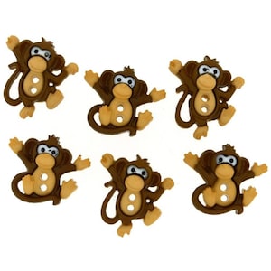 May include: Six brown plastic monkey buttons with beige faces and white eyes. The buttons have two holes for sewing.