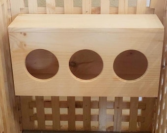 Comedero de heno para la cubierta de la caja de arena