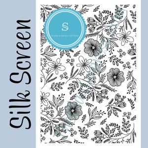 May include: A white silk screen with a black floral pattern of flowers and leaves. The text "Silk Screen" is on the left side in a cursive font. A blue circle with the letter "S" and the words "Studs & Small Cutters" is in the upper center.