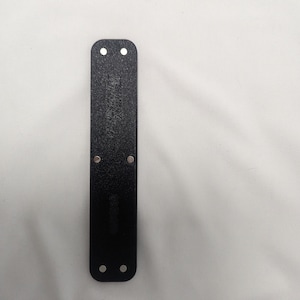 May include: Black leather wristband with four silver metal rivets.