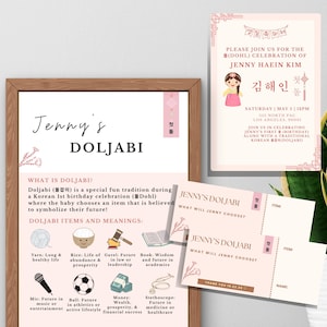 May include: A framed invitation and informational cards for a Doljabi celebration. The invitation features a cartoon girl and text in English and Korean. The informational card lists items and meanings.