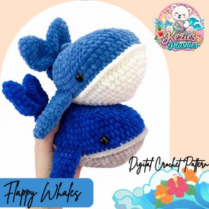 May include: Two handmade crochet whale plushies made from soft blue yarn. The top whale features a white underbelly, while the bottom whale has a light grey underbelly. Both whales have small black plastic eyes and prominent tail fins.
