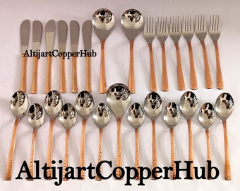 May include: A set of 20 copper-toned stainless steel utensils, including spoons, forks, and butter knives. The utensils have a hammered finish and are arranged in two rows on a white surface. The text "AltijjartCopperHub" appears twice in the image.