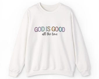 May include: White sweatshirt with a colourful graphic that says "GOD IS GOOD all the time".
