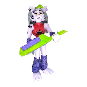May include: A white and purple furry figure with a red and black top and a green and purple guitar. The figure has a black star on its chest and a purple earring.