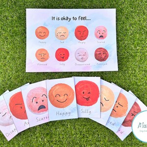 May include: A set of 10 colourful cards with different facial expressions and the words "It is okay to feel..."  The cards include happy, sad, angry, scared, worried, silly, disappointed, annoyed, and more.