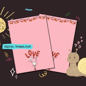 May include: Printable pink stationery with a red heart garland border. The top sheet features a cartoon girl holding red balloons that spell "LOVE". The bottom sheet has lined paper with a snail illustration.