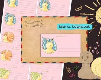 May include: Pink address labels with snail illustrations and the text "Please Deliver To". A brown envelope with the text "DIGITAL DOWNLOAD" is also shown. The labels feature various snail designs with blue, orange, and green shells.