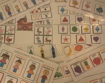 May include: Educational flashcards with illustrations of family members, farm animals, shapes, emotions, fruits, and colours. The cards include words in English and Spanish, with a barn illustration and numbers.