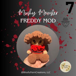 May include: A brown crocheted Freddy Krueger doll with red and black striped clothing. The doll is sitting on a hand and has large, glittery eyes. The background is a dark gray with red splatters. The text "Mushy Monster FREDDY MOD" is at the top of the image. The number "7" is in the top right corner of the image.