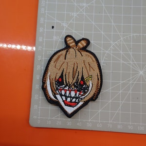 Parche de mueca "Nanashi Mumei" del 2.º HoloConsejo de HoloLIVE EN