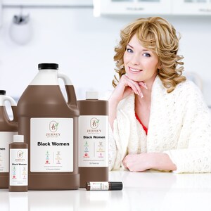 May include: Four brown bottles of liquid with white labels that say "Jersey Botanicals Black Women" and list ingredients. The bottles are in different sizes.