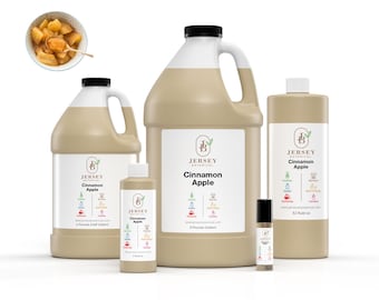 May include: Four bottles of Cinnamon Apple scented oil in various sizes, from a small roll-on bottle to a large gallon jug. The bottles are all brown and have a white label with the Jersey Botanical logo and the scent name.