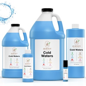 May include: Four bottles of blue liquid with a white label that says "Jersey Botanical Cold Waters". The bottles are in different sizes, from a small roll-on bottle to a large gallon jug. The label also lists the uses for the product, including diffusers, burners, soaps, bath and body, and candles.