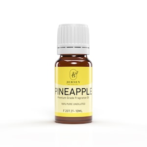 May include: A brown glass bottle with a white cap, labeled "Jersey Botanical Pineapple Premium Grade Fragrance Oil." The label is yellow with black text, including "100% PURE UNDILUTED" and "F 207.30 - 10ML."
