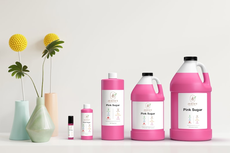 May include: Four bottles of pink sugar scented body oil in different sizes. The bottles are labeled "Jersey Botanical" and "Pink Sugar".