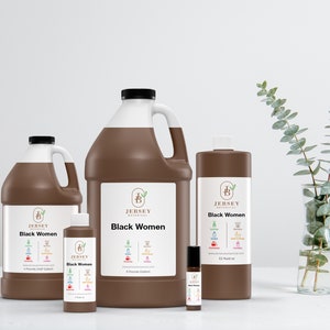 May include: Four brown bottles of "Black Women" essential oil in different sizes, from a small roll-on bottle to a large gallon jug. The bottles are labeled with the company logo, "Jersey Botanical", and a list of ingredients.