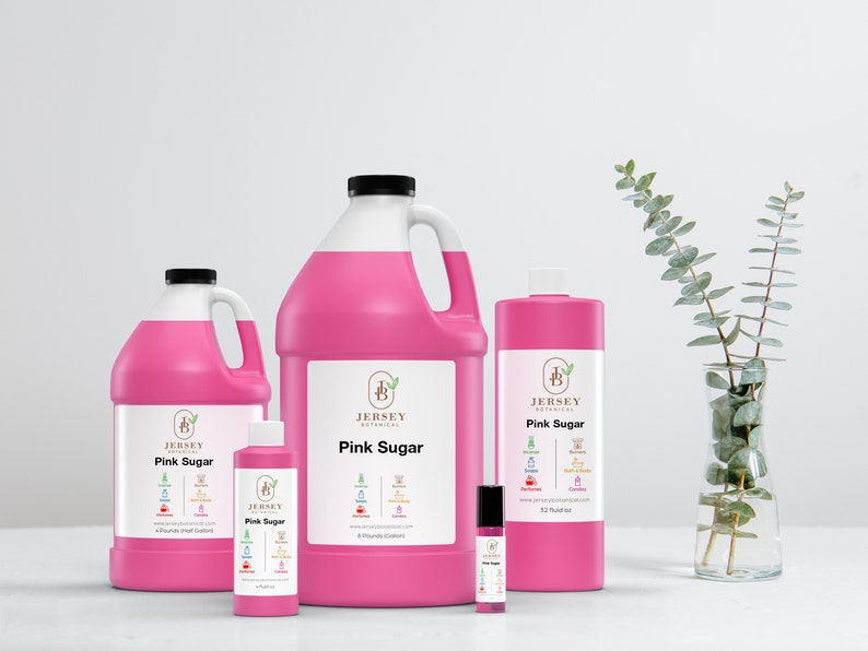 May include: Four bottles of pink sugar fragrance oil in different sizes. The bottles are labeled "Jersey Botanical" and "Pink Sugar". The smallest bottle is a roll-on and the largest bottle is a gallon.