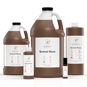 May include: Four brown plastic bottles of Somali Rose essential oil from Jersey Botanical. The bottles are in different sizes, from a small roll-on bottle to a large 1/2 gallon jug. The label features a green leaf logo and the text "Somali Rose".