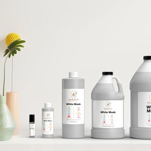 May include: Four bottles of White Musk essential oil in different sizes. The bottles are labeled with the Jersey Botanicals logo and the scent name. The bottles are arranged in a row from smallest to largest.