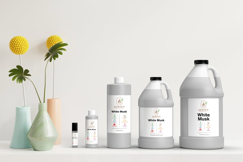 May include: Four bottles of White Musk essential oil in different sizes. The bottles are labeled with the Jersey Botanicals logo and the scent name. The bottles are arranged in a row from smallest to largest.