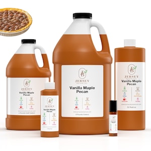 May include: Four bottles of vanilla maple pecan scented oil in various sizes, from a small roll-on bottle to a large 1-gallon jug. The bottles are all brown and have a white label with the Jersey Botanical logo and the scent name. The image also includes a small pie with a pecan filling.