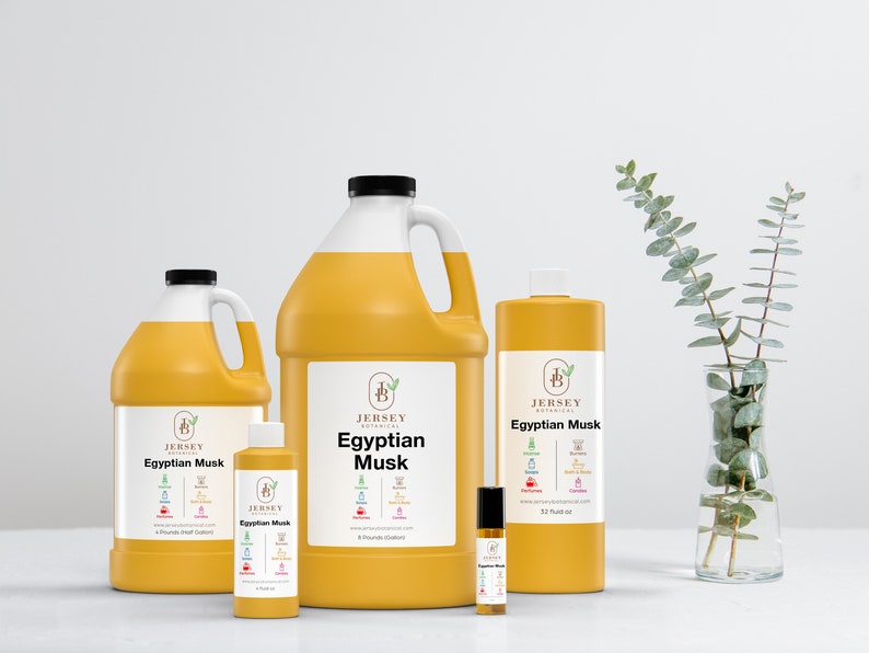 May include: Four bottles of Egyptian Musk essential oil in various sizes, from a small roller bottle to a large gallon jug. The bottles are all yellow and feature the Jersey Botanical logo and product name.