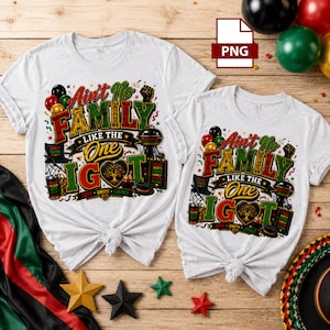 May include: Two light gray t-shirts featuring a graphic print with the text Ain't No Family Like The One I Got. The design includes illustrations of a grill, a folding chair, a tree, and balloons in red, green, black, and yellow colors.