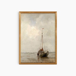 May include: A framed painting depicting a sailboat on a beach with a cloudy sky. The sailboat has a white sail and a red flag at the top of the mast. There are people on the boat and the water is calm.