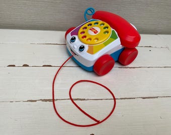Teléfono de juguete con forma de parlanchín de Fisher Price 2015