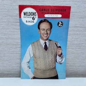May include: A vintage knitting pattern for a cable pullover sweater. The pattern is for sizes 35 to 44 inches and uses 3-ply yarn. The pattern is from Weldons Knitwear and is priced at 6 pence. The pattern features a man wearing the sweater and holding a pipe.