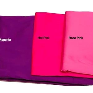May include: Five folded fabric swatches in shades of pink and orange. The colors are labeled: Baby Pink, Magenta, Hot Pink, Rose Pink, and Orange. The fabric appears to be a smooth, possibly satin, material.