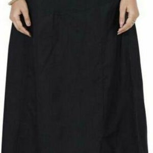 May include: Black cotton underskirt with a single pocket. The underskirt is long and flowy.
