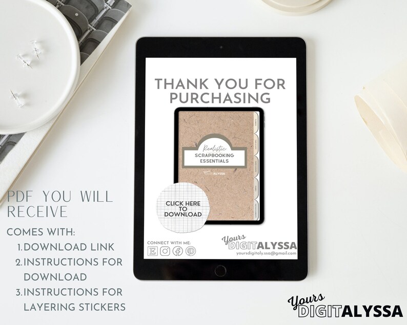 May include: A digital download for a realistic scrapbooking essentials kit. The image shows a tablet screen displaying a brown paper notebook with the text "Realistic Scrapbooking Essentials" and a button that says "Click Here to Download".