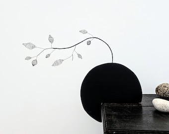 An Abstract Wire Branch with Sculptural Pods as a Modern Piece of Botanical Art