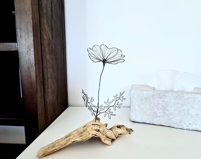 A Wire Flower Sculpture on Atlantic Driftwood as a Unique Piece of Coastal Beach House Art