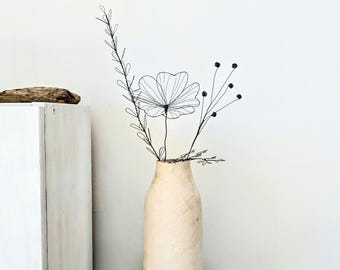 A Small Wire Bouquet with a Meadow Bloom as a Delicate Piece of Botanical Art