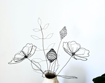 A Wire Bouquet of Wildflowers and Woven Cones as a Modern Rustic Sculpture