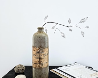 An Abstract Wire Branch with Sculptural Pods as a Modern Piece of Botanical Art